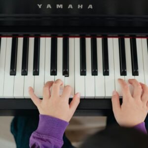 a person playing a piano with their hands